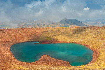 The volcanic lake in the crater of Azhdahak volcano in Gegham mountains, Armenia