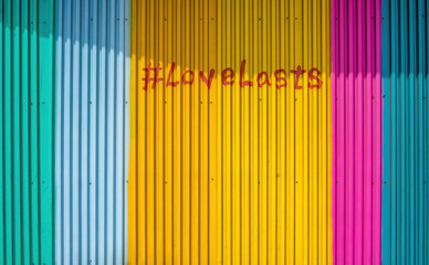 #LoveLasts Painted on Vibrant Backdrop