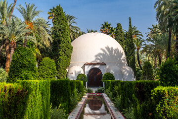 Visitor center building and fountain in the palm grove park in the city of Elche. Spain