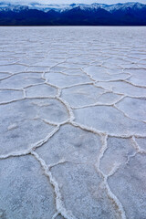 Obraz premium Death Valley National Park, Salt with clay, California. Smooth salt valley with cracked and swollen salt, dead salt landscape
