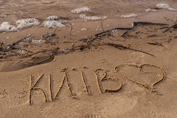 Kyiv, Ukraine - December 29, 2023: Dnipro embankment. the word "Kyiv" is written in the sand