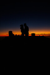 Silhouetted couple against a sunset