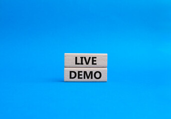 Live Demo symbol. Concept word Live Demo on wooden blocks. Beautiful blue background. Business and...