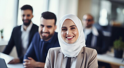 Muslim businesswoman woman with her work team