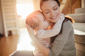Mother and daughter playing at home
