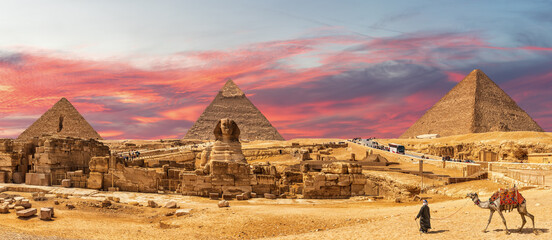 Great Pyramids of Giza and the Sphinx, bedouin with a camel, beautiful panorama of Cairo region,...