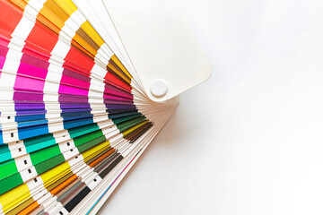 Paint swatches color guide isolated on white background, top view