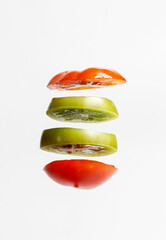 Sliced tomatoes on a white background