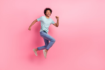 Fototapeta na wymiar Full body photo of attractive young man running hurry black friday wear trendy blue clothes isolated on pink color background