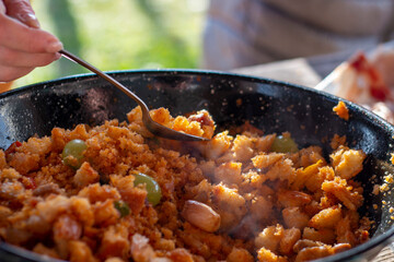 Cooking the typical Spanish dish of 