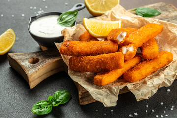 Crispy Fish strips with tartar sauce. Restaurant menu, dieting, cookbook recipe top view