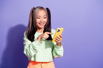 Photo of chinese blogger youngster girl select option in online using smartphone order pizza...