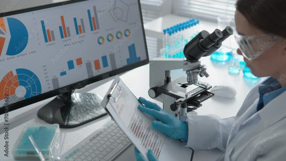 Poster Laboratory work at the computer research center is devoted to the study of chemical processes and the development of new medical technologies. In a hazmat suit, the scientist carefully examines a