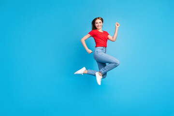 Fototapeta premium Photo of sporty optimistic girl dressed trendy outfit advertising clothes collection isolated on blue color background