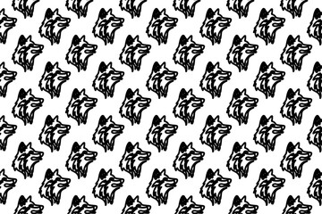 Seamless pattern completely filled with outlines of wolf heads. Elements are evenly spaced. Vector illustration on white background