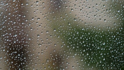 Rain Water Drops Flowing Down Window Glass Surface