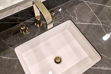 Looking down at bathroom vanity sink - 700330427