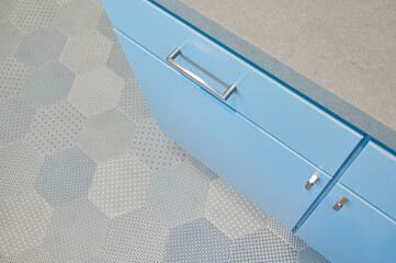 Blue Cabinets with Hexagon Tile Floor
