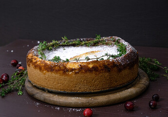 Cheesecake with cranberries. Christmas cake. Rustic style