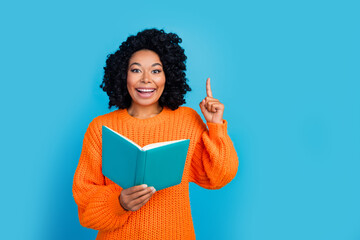 Photo portrait of pretty young girl eureka idea reading book dressed stylish knitted orange outfit...