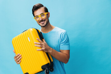Yellow man travel traveler suitcase trip baggage studio background happy journey flight weekend...