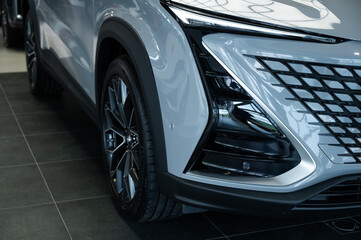 Close-up of the headlight of a white modern car. 