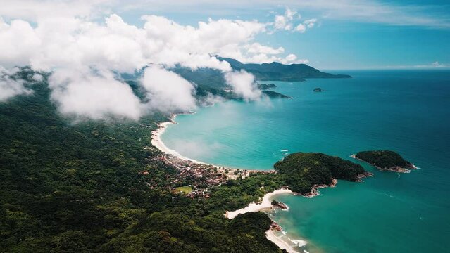 Beach in Brazil. Aerial view of the coastline with perfect sandy beaches, blue sea and clouds flying in the sky. Area of the town of Paraty in Brazil