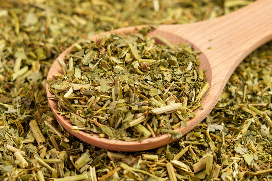 Dried Passiflora herbs for sedative tea. Passion flower dry leaves in wooden spoon.
