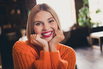 Photo of gorgeous peaceful positive girl arms touch cheeks beaming smile good mood pastime chill...