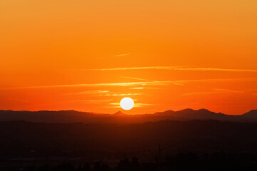Colorful sunset on top of Italian mountain alps. Beautiful mountain landscape. Morning sunrise time mountain scenery.