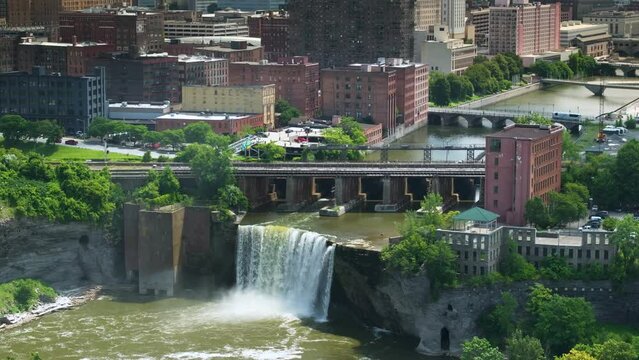 High Falls on Genesee River in Rochester city, New York. Panoramic view of urban city skyline with historical northeastern architecture in upstate NY