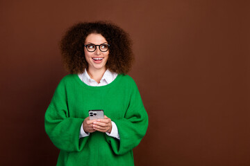 Photo of pretty excited person hold smart phone look empty space instagram facebook telegram...