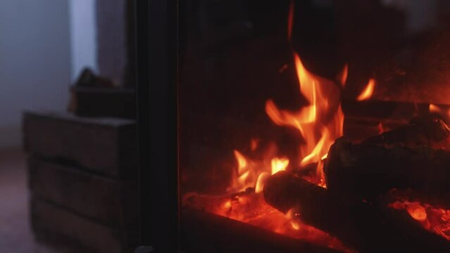 Log burner interior fireplace, warm cosy winter interior fire, wood fire burning, rustic heating