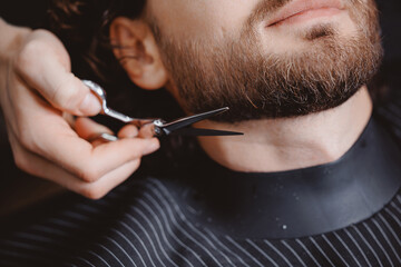 Barber process shaving razor bearded hipster man in barbershop