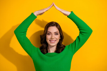 Photo of lovely cute glad woman real estate agency worker two hand above head demonstrate roof isolated on yellow color background - obrazy, fototapety, plakaty