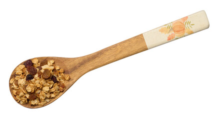 Oatmeal, raisins, cashews and almonds. Granola in a wooden spoon, top view