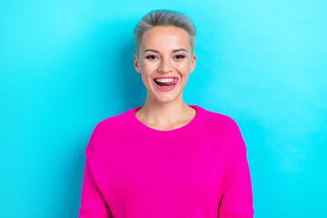 Portrait of funky funny gorgeous girl with dyed hairdo wear knit sweater tongue licking teeth isolated on turquoise color background