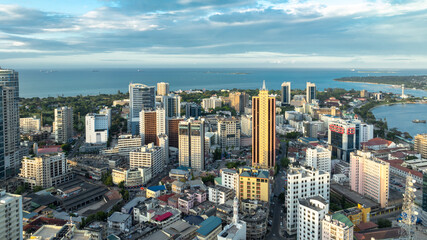 Fototapeta na wymiar Cityscape of Dar es Salaam at sunset featuring residential and office buildings.