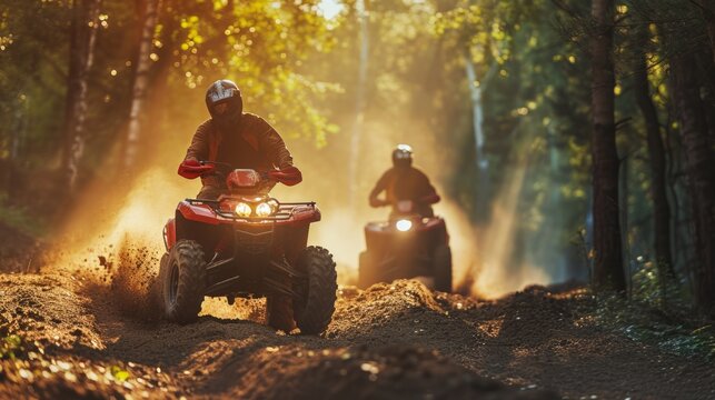 ATV racers take part in speed races in the forest. Concept of the excitement of off-road racing on ATVs in a natural environment