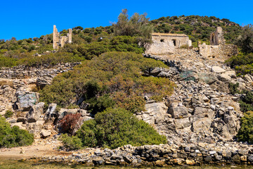 Fototapeta na wymiar Antique ruins of an ancient city on the island. Background with selective focus and copy space