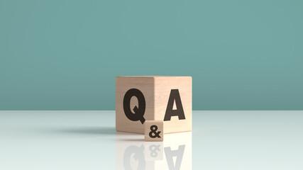 Q & A, questions and answers wooden block cube with green background