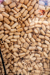 pile of macaroni popcorn or macaroni chips on a street vendor cart on countryside of Brazil