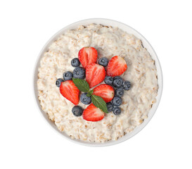 Tasty boiled oatmeal with berries in bowl isolated on white, top view