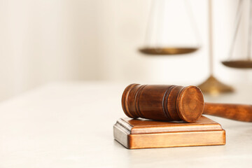 Law concept. Gavel on white table, closeup. Space for text