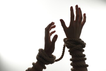 Freedom concept. Woman with tied arms on white background, closeup