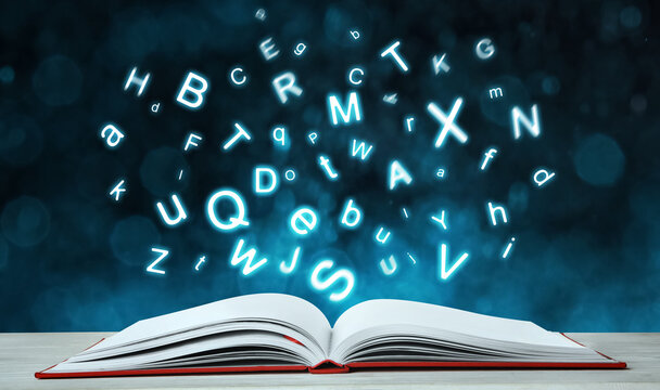 Letters flying out from open book on table, bokeh effect. Banner design