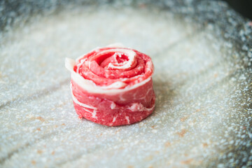 Premium rare slices of beef looks like flowers in the restaurant look appetizing. Close up