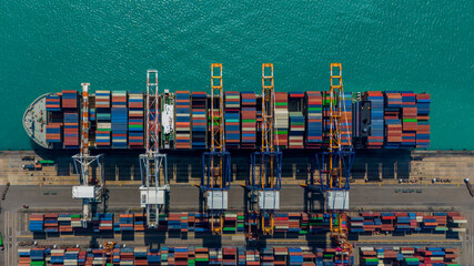 Industrial import-export port prepare to load containers. Aerial top view container ship in export...