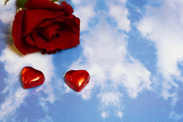 valentines day rose and chocolates on a sky background pattern