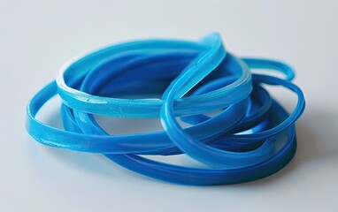 Fototapeta premium blue rubber band on white studio background